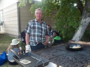 Clem Perrault on barbecue duty at AFZP's Saint Jean Baptiste celebrations